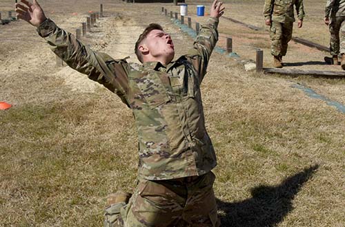 Spec. Colin Perry completes the obstacle course